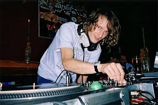 DJ KripStar spinning a Reggae classic by the Scorpions, minus the hat at the legendary Coconut pub, Kingston upon Thames 2004